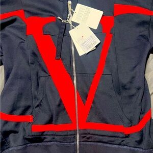 This is a navy blue Valentino designer brand zip up hoodie